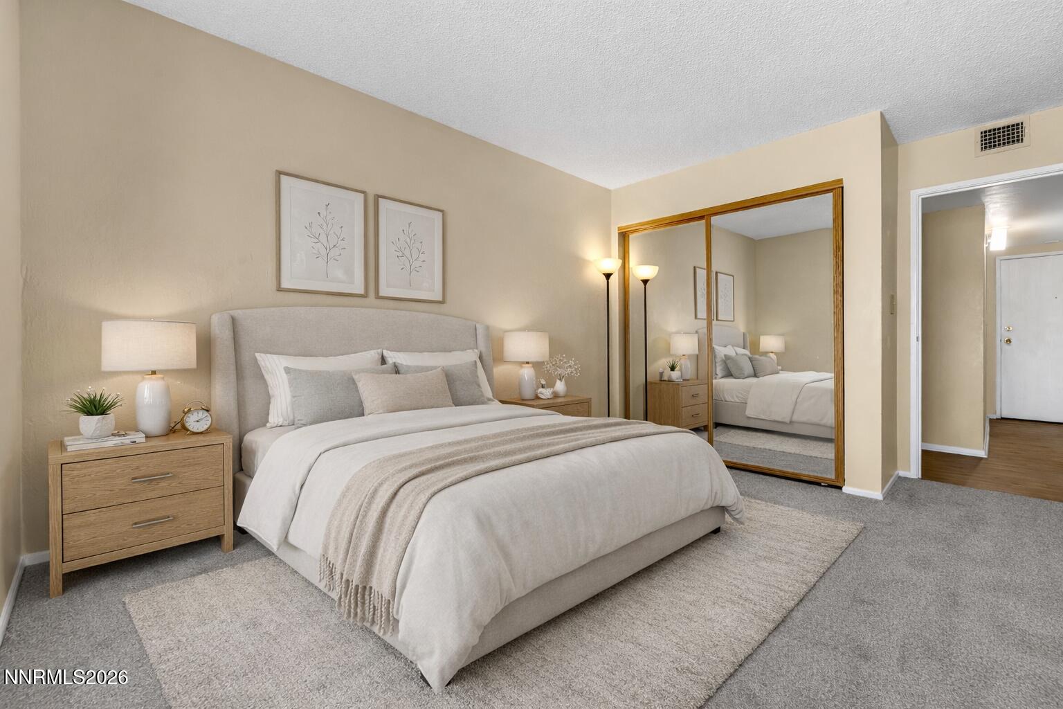 2845 Idlewild Drive, Unit 204 Reno, NV 89509 - Photo 13 of 29 a bedroom with a bed and a lamp