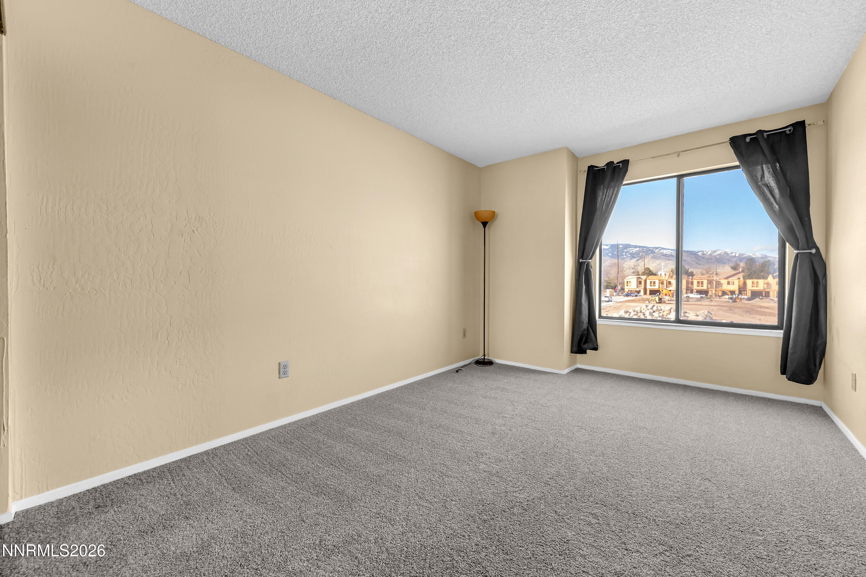 2845 Idlewild Drive, Unit 204 Reno, NV 89509 - Photo 15 of 29 an empty room with windows