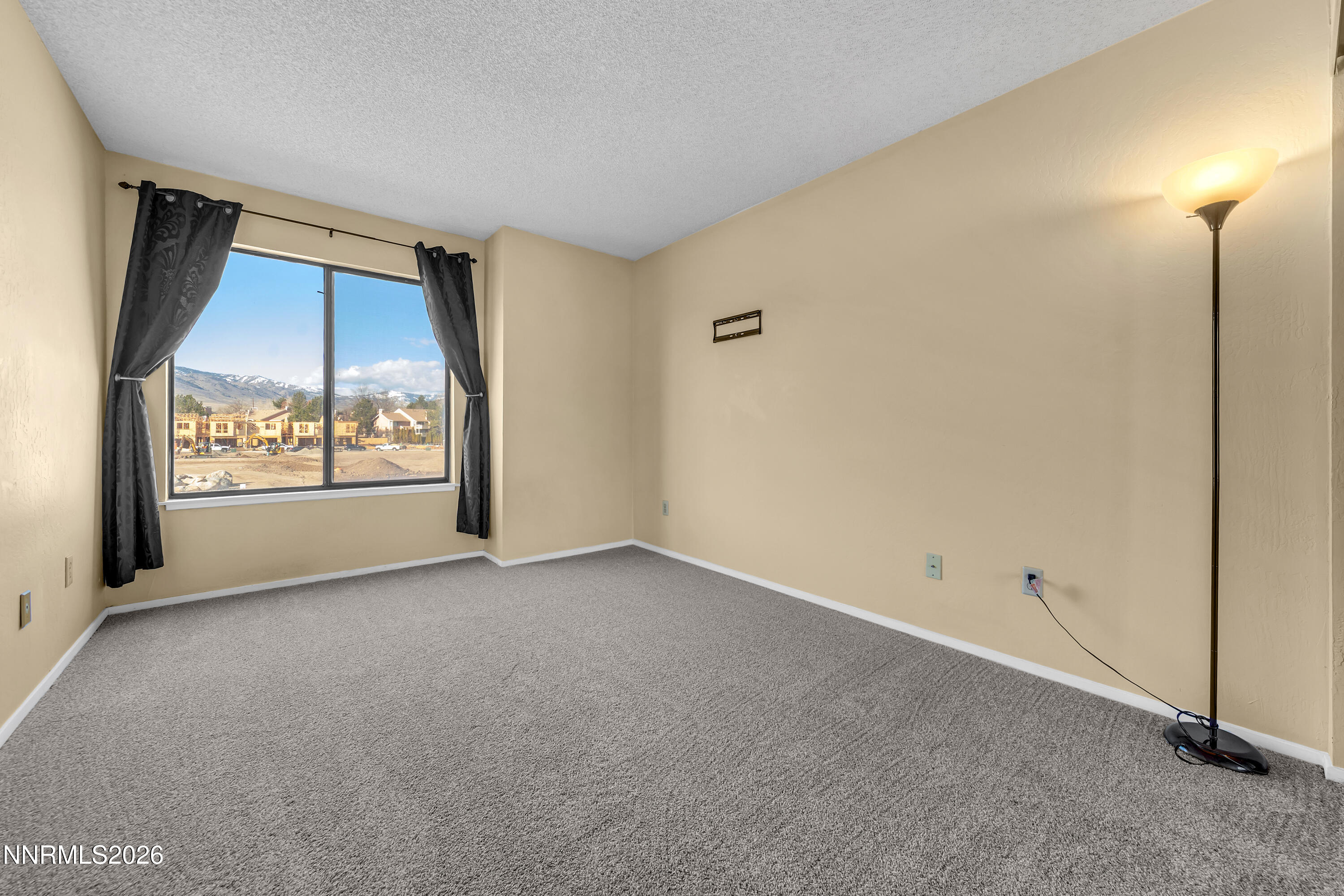 2845 Idlewild Drive, Unit 204 Reno, NV 89509 - Photo 16 of 29 an empty room with windows