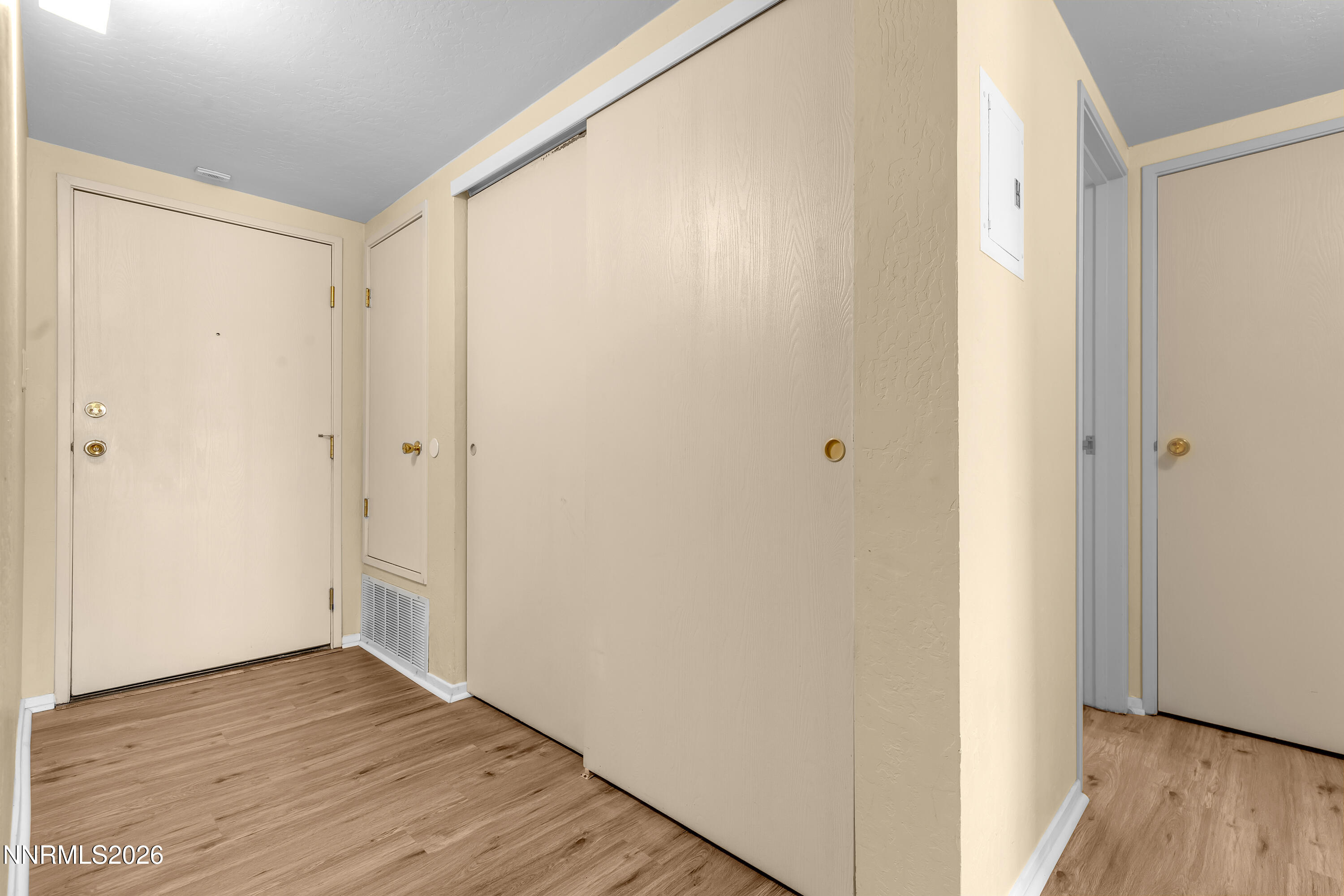 2845 Idlewild Drive, Unit 204 Reno, NV 89509 - Photo 21 of 29 a view of a hallway with wooden floor