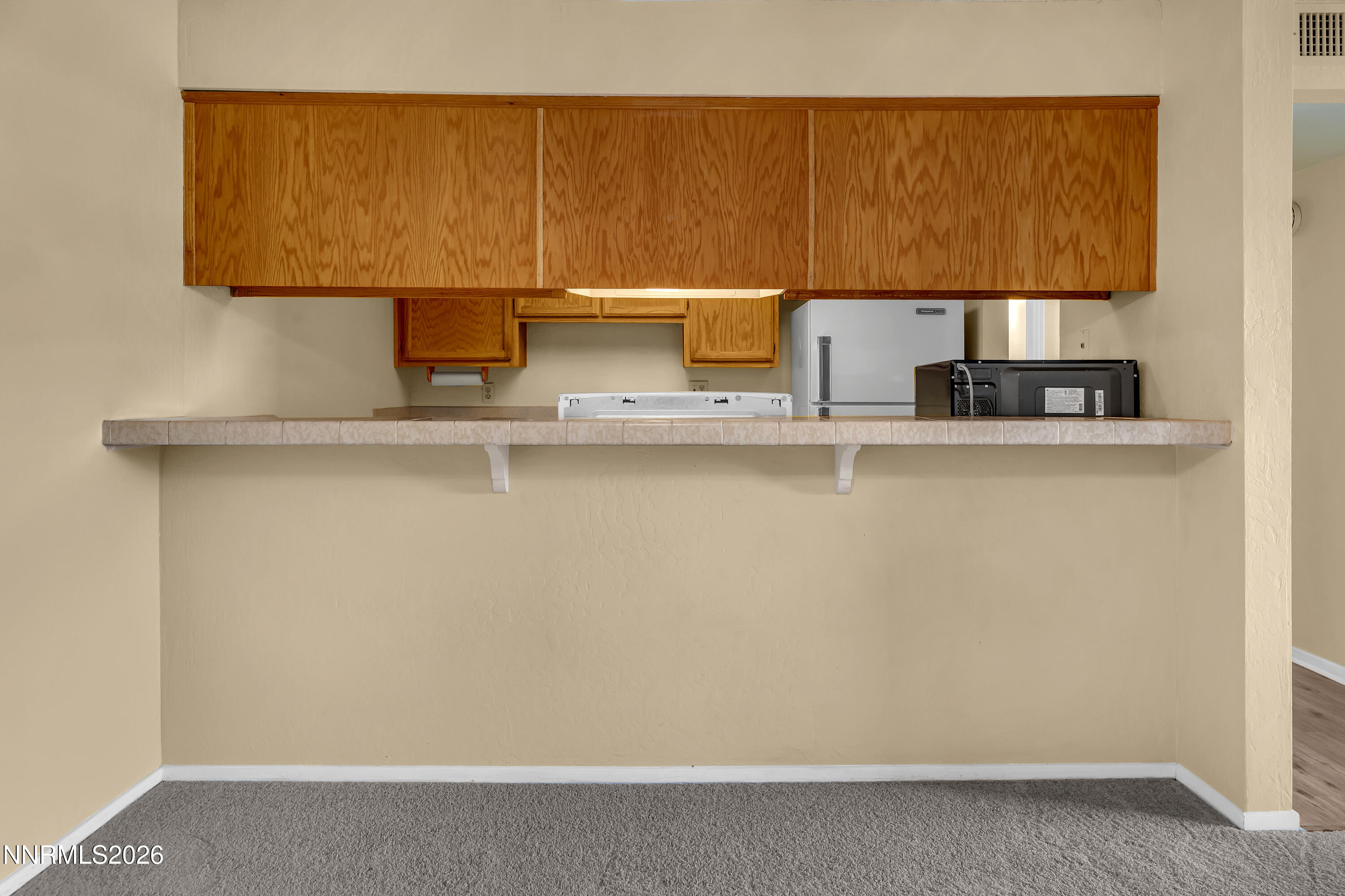 2845 Idlewild Drive, Unit 204 Reno, NV 89509 - Photo 7 of 29 a view of kitchen cabinets and sink