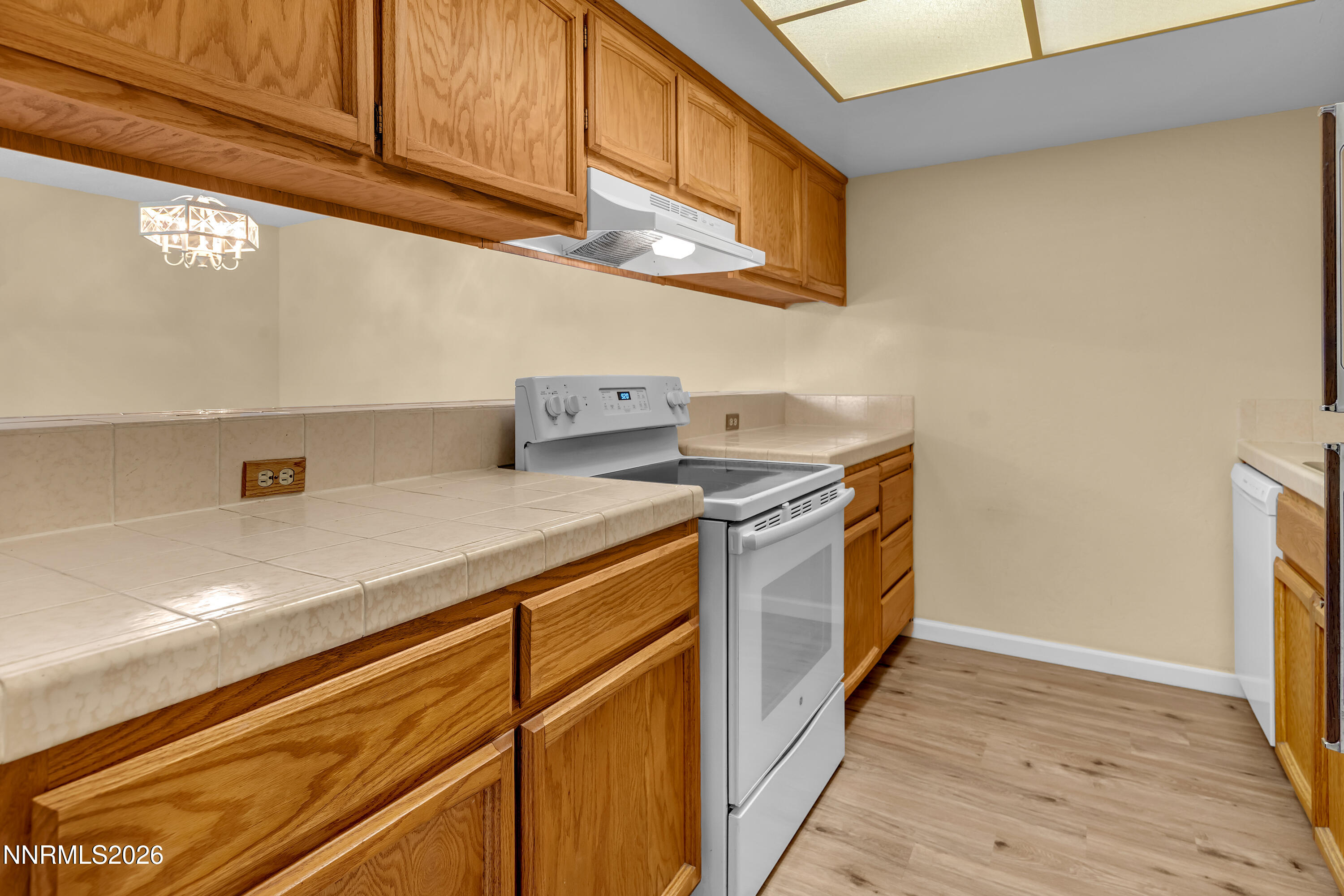 2845 Idlewild Drive, Unit 204 Reno, NV 89509 - Photo 8 of 29 a kitchen with stainless steel appliances granite countertop a sink and a stove