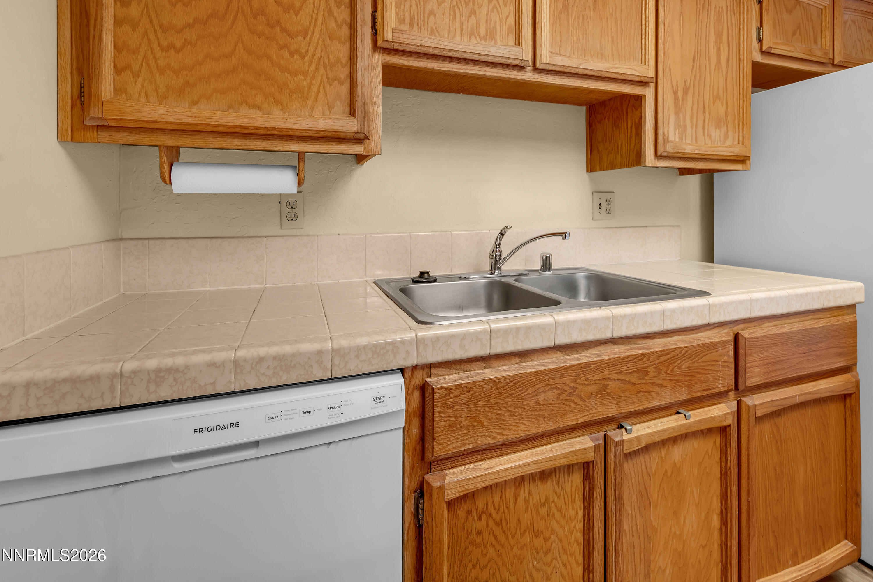 2845 Idlewild Drive, Unit 204 Reno, NV 89509 - Photo 9 of 29 a kitchen with a sink and cabinets