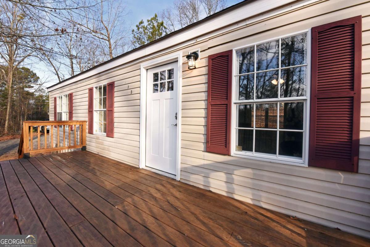 273 Rose Ray Road Ellijay, GA 30540 - Photo 9 of 32 a view of a house with wooden floor