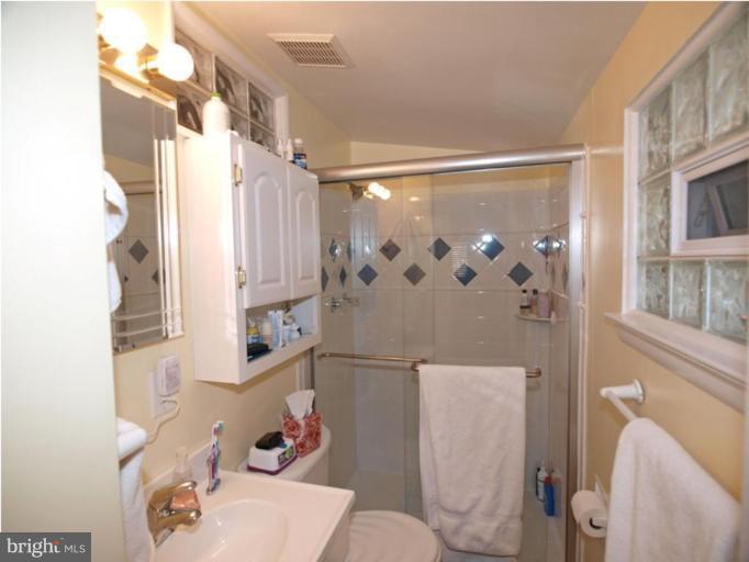 711 North Belgrade Road Silver Spring, MD 20902 - Photo 2 of 25 a bathroom with a sink toilet and shower