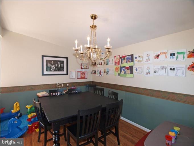 711 North Belgrade Road Silver Spring, MD 20902 - Photo 17 of 25 a view of a dining room with furniture and wooden floor