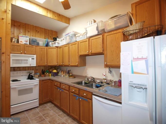 711 North Belgrade Road Silver Spring, MD 20902 - Photo 19 of 25 a kitchen with a sink cabinets and appliances