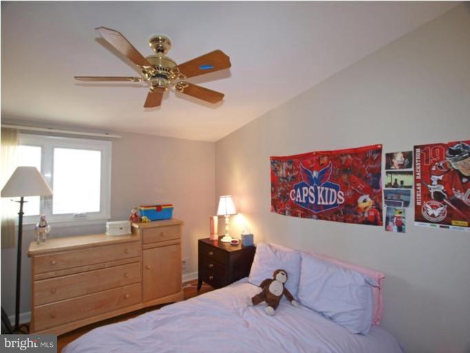 711 North Belgrade Road Silver Spring, MD 20902 - Photo 3 of 25 a bed room with a bed