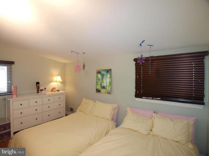 711 North Belgrade Road Silver Spring, MD 20902 - Photo 21 of 25 a bedroom with a bed and dresser