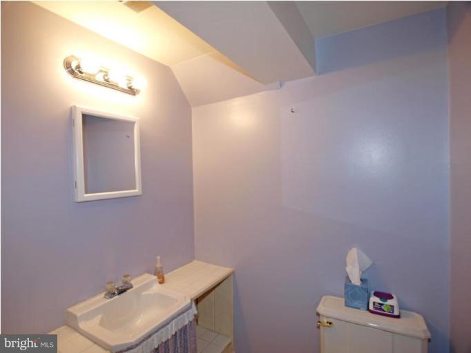 711 North Belgrade Road Silver Spring, MD 20902 - Photo 23 of 25 a bathroom with a sink mirror and vanity