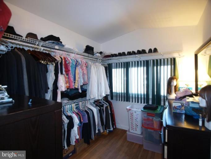 711 North Belgrade Road Silver Spring, MD 20902 - Photo 4 of 25 a view of walk in closet with clothes and shoes