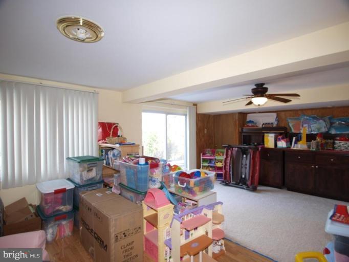711 North Belgrade Road Silver Spring, MD 20902 - Photo 5 of 25 a living room filled with furniture and a window