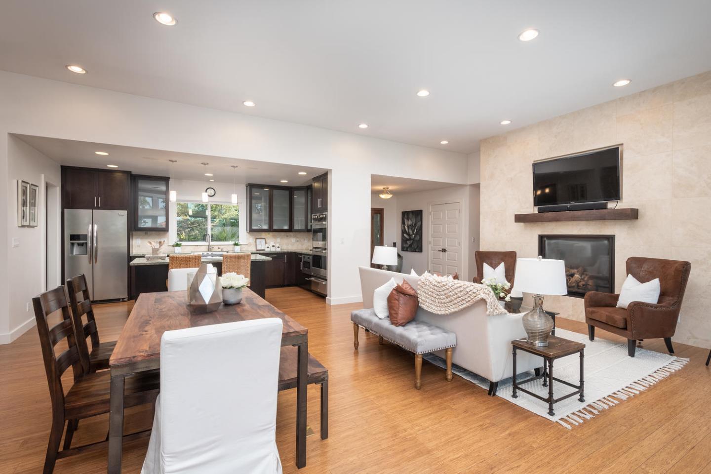 672 Moraga Road Lafayette, CA 94549 - Photo 14 of 43 a living room with fireplace furniture and a flat screen tv