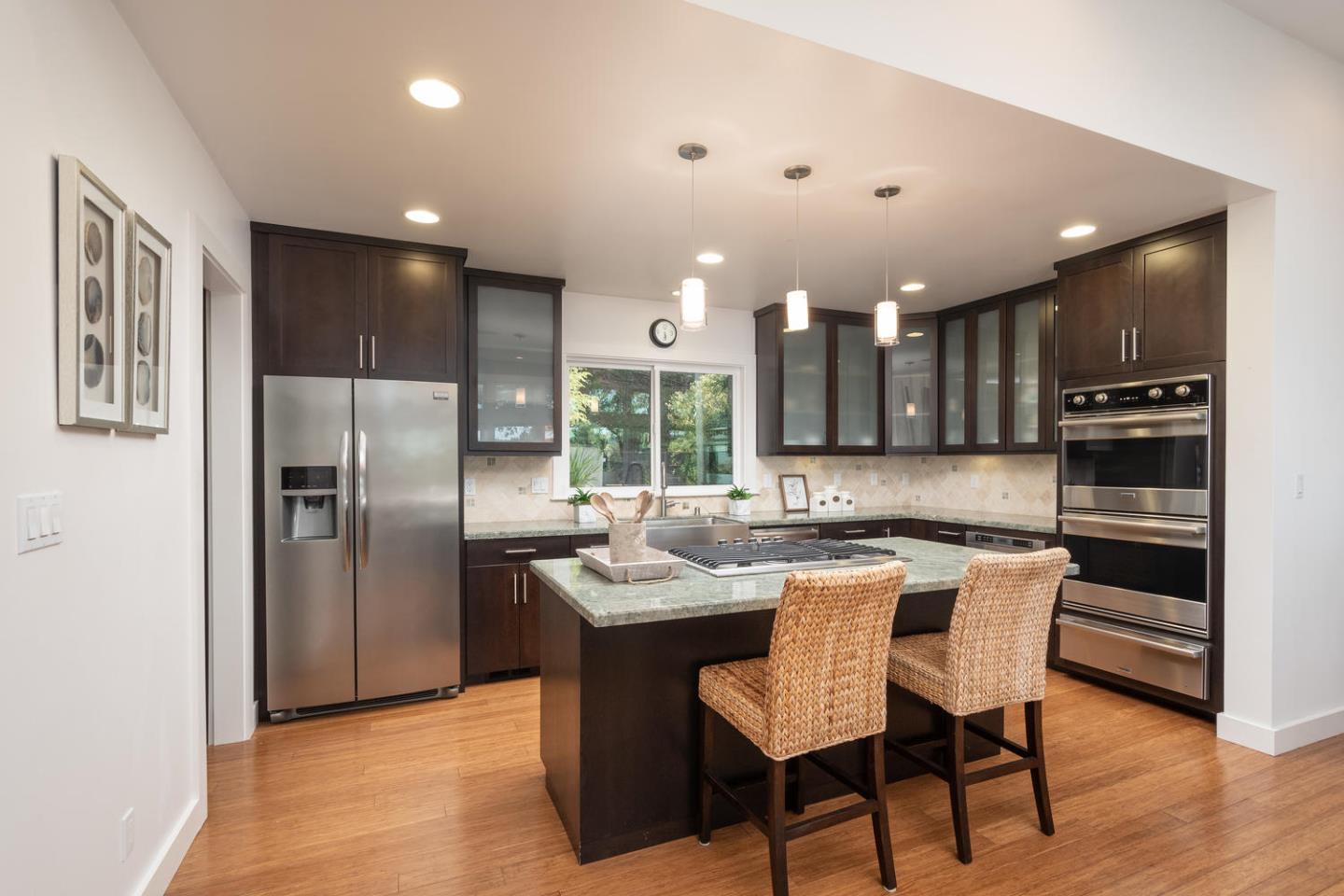 672 Moraga Road Lafayette, CA 94549 - Photo 15 of 43 a kitchen with kitchen island a refrigerator and a sink