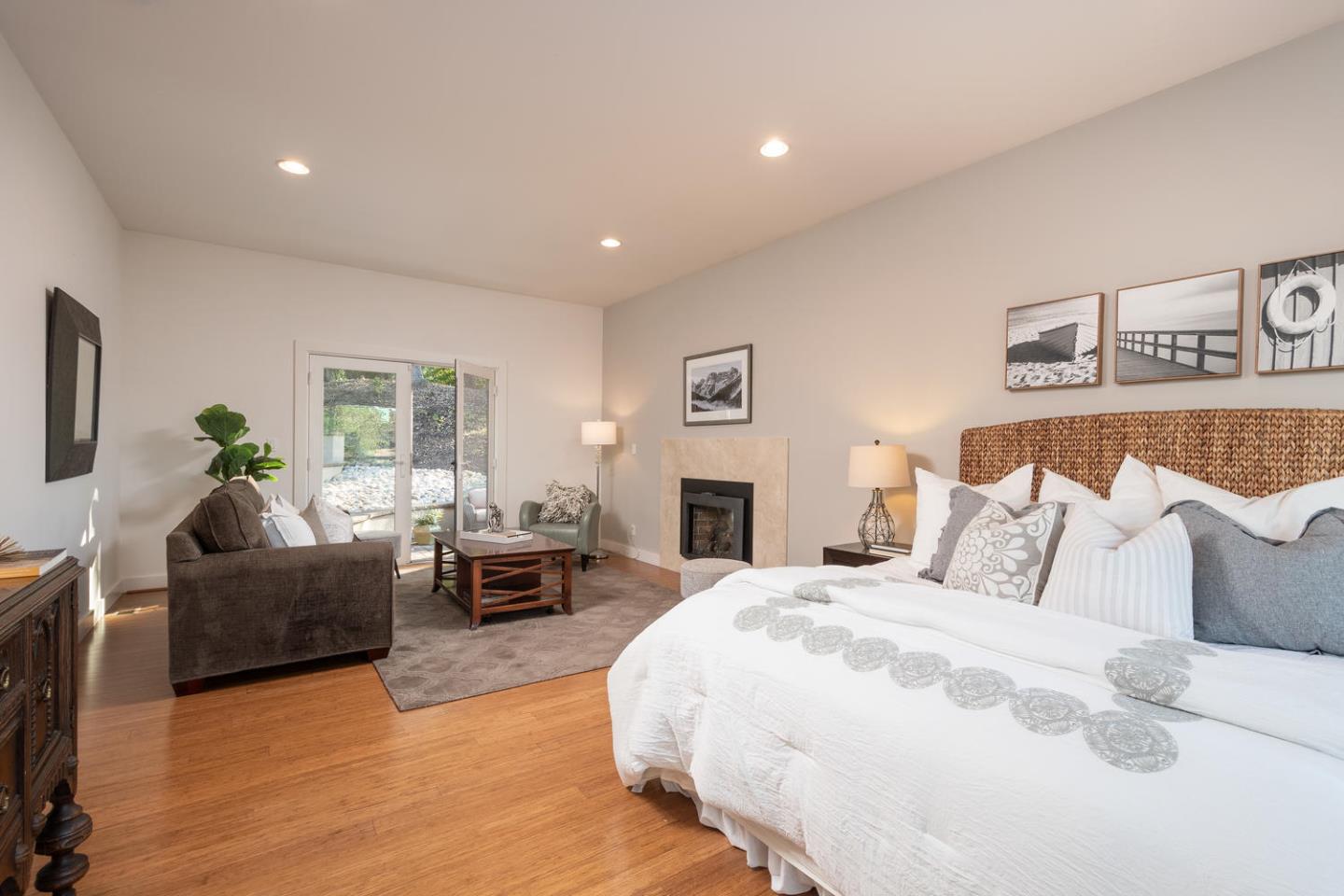 672 Moraga Road Lafayette, CA 94549 - Photo 18 of 43 a spacious bedroom with a bed a couch and a couch