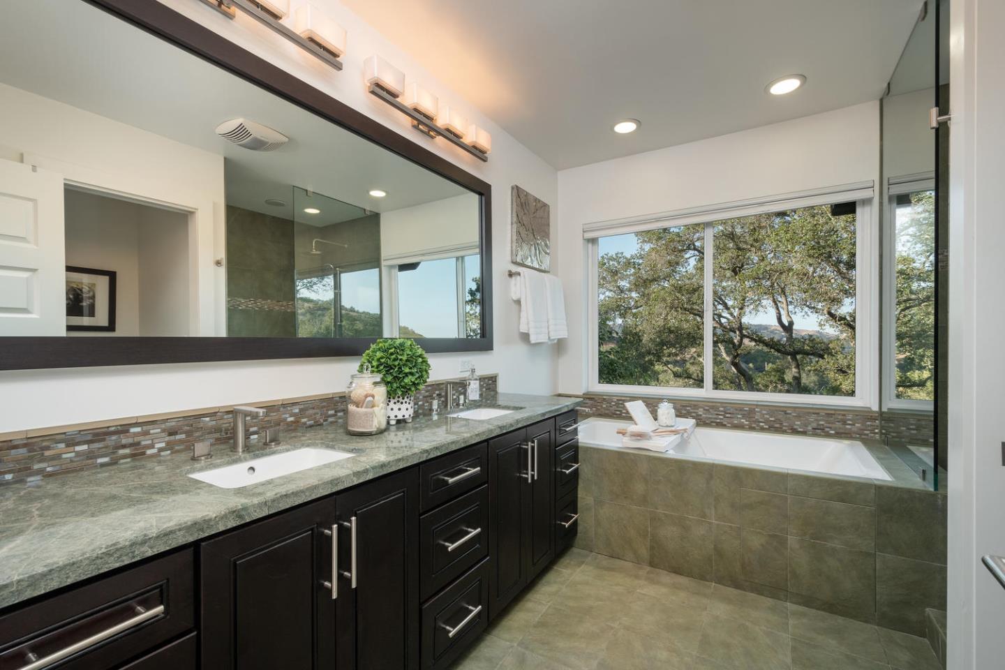 672 Moraga Road Lafayette, CA 94549 - Photo 21 of 43 a bathroom with a granite countertop bathtub sink vanity and mirror