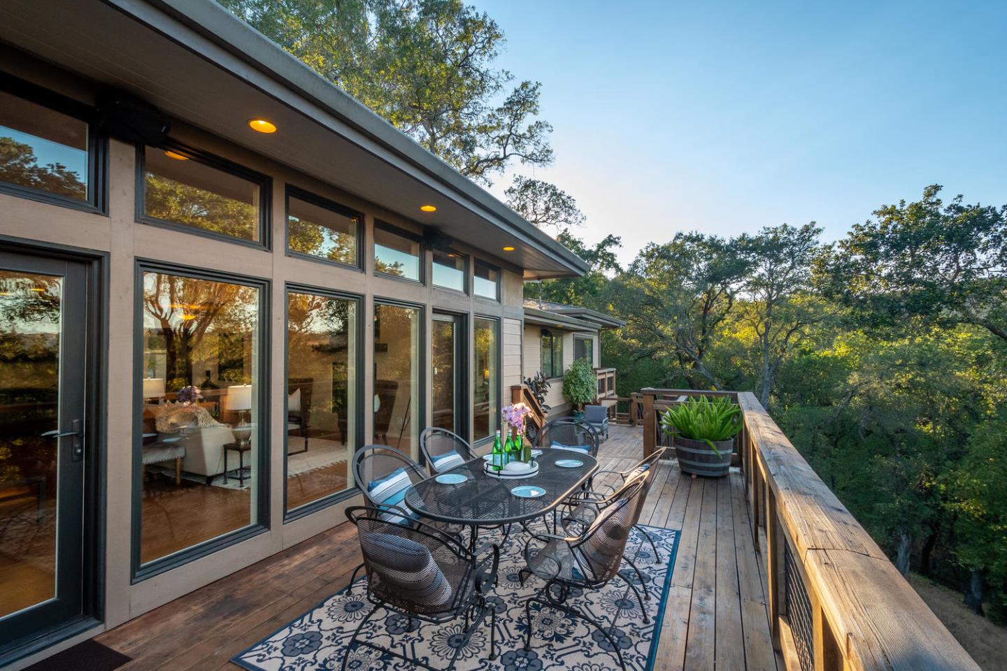 672 Moraga Road Lafayette, CA 94549 - Photo 33 of 43 a view of a patio with table and chairs potted plants with floor to ceiling window and wooden floor