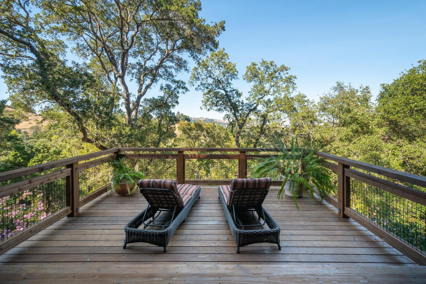 672 Moraga Road Lafayette, CA 94549 - Photo 34 of 43 a view of a deck with two chair and wooden floor