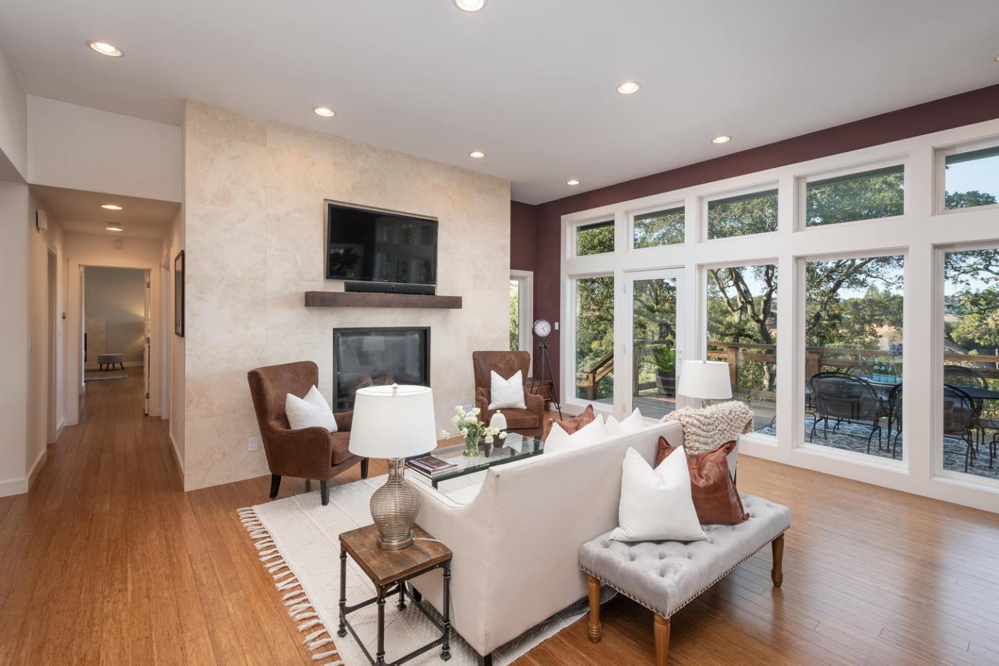 672 Moraga Road Lafayette, CA 94549 - Photo 10 of 43 a living room with fireplace furniture and a flat screen tv