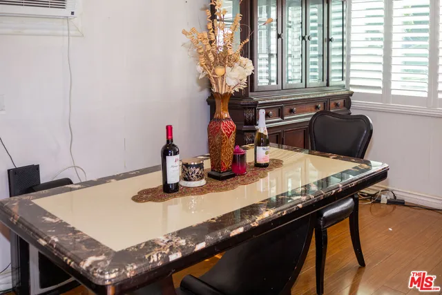 a kitchen with a table chairs and a granite counter top