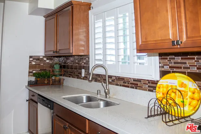 a kitchen with a sink and a window