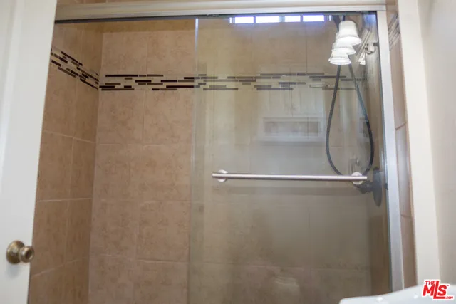 a close view of a shower in bathroom
