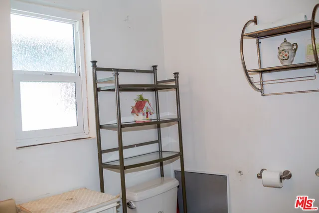 a bedroom with a bed and a table in it