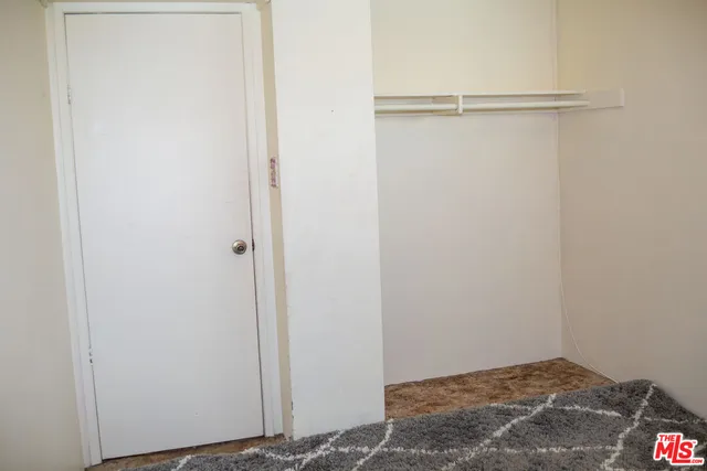 a view of small space with racks on the wall