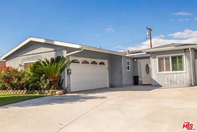a front view of a house with a garage