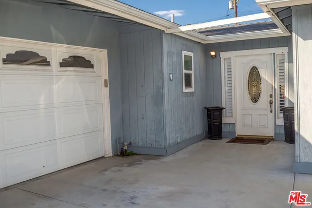 a view of a hallway with washer and dryer