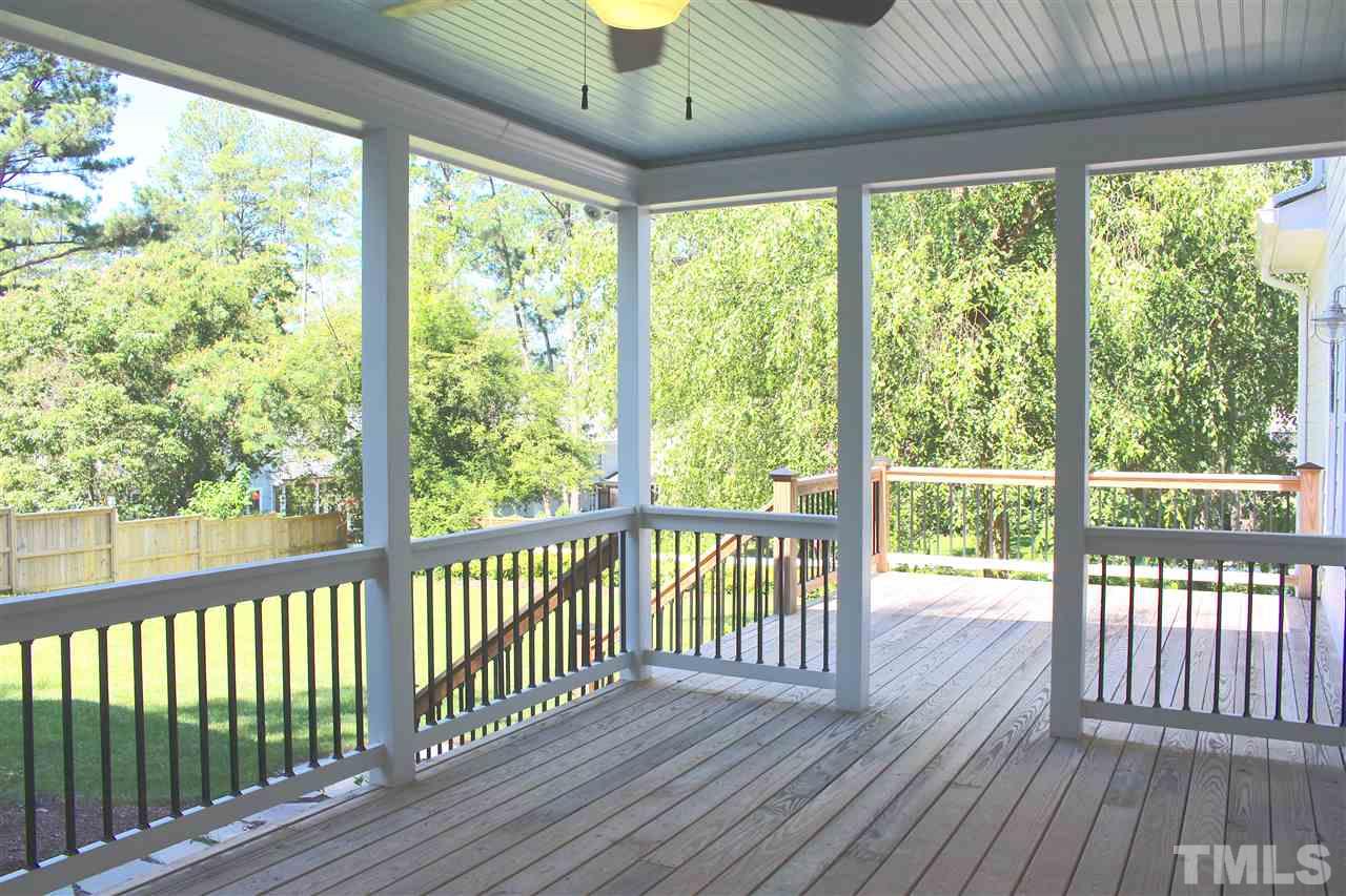 741 Shelley Road Raleigh, NC 27609 - Photo 22 of 25 a view of a wooden deck with a yard