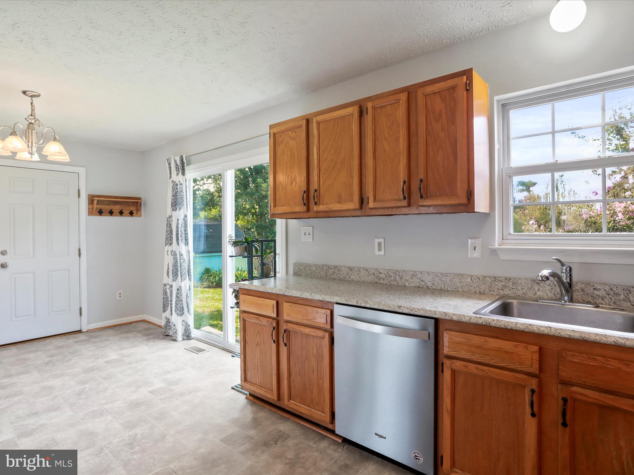 100 Lloyds Road Winchester, VA 22602 - Photo 15 of 39 a kitchen with a sink cabinets and window