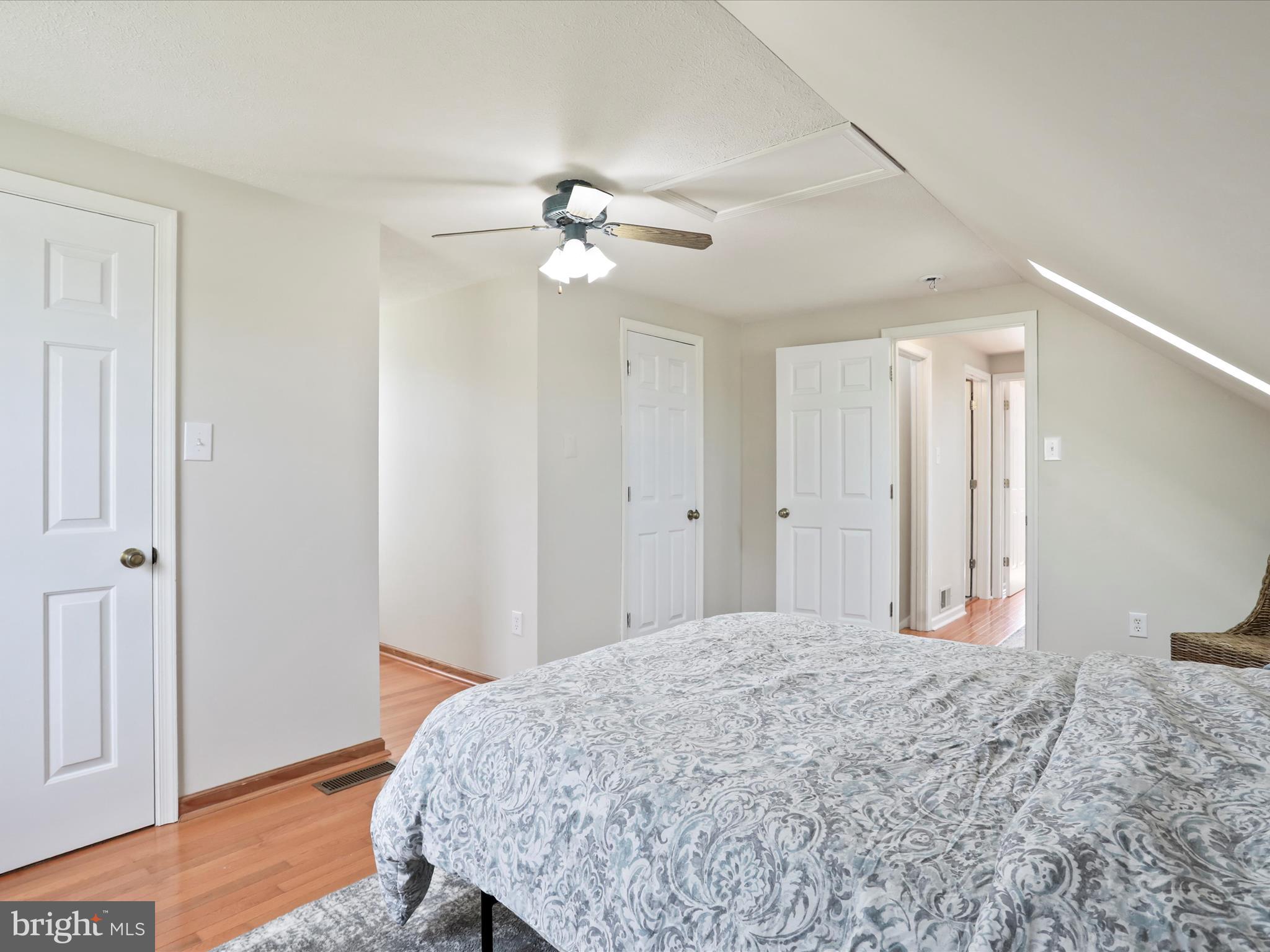 100 Lloyds Road Winchester, VA 22602 - Photo 31 of 39 a bedroom with a bed and a chandelier