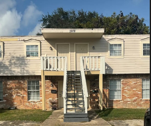 1502 Oleander La Marque, TX 77568 - Photo 1 of 6 a front view of a house with garage