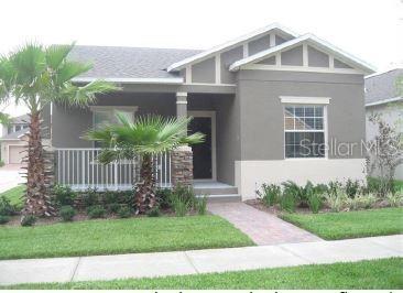 7110 Little Field Lane Winter Garden, FL 34787 - Photo 1 of 1 a front view of a house with garden