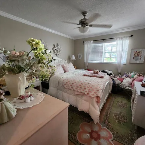 a bedroom with bed and a window