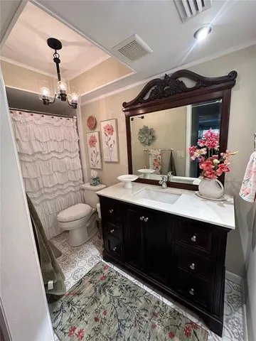 a bathroom with a sink vanity and a mirror
