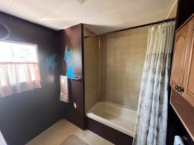 a room with refrigerator and window