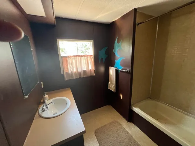 a view of a couches in the backyard of house