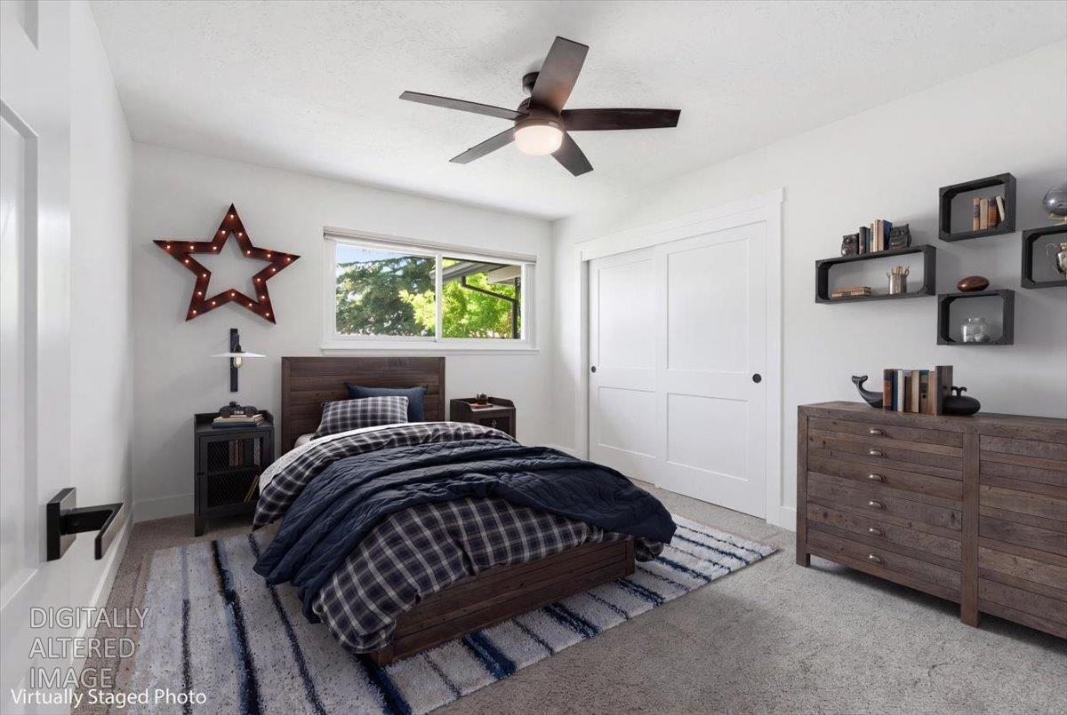 4849 Alexon Way Carmichael, CA 95608 - Photo 28 of 50 a bedroom with a bed and a chandelier