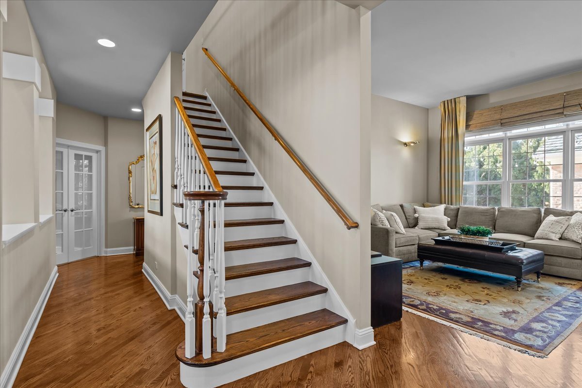 891 Carroll Road Lake Forest, IL 60045 - Photo 24 of 39 a view of a livingroom with wooden floor and stairs