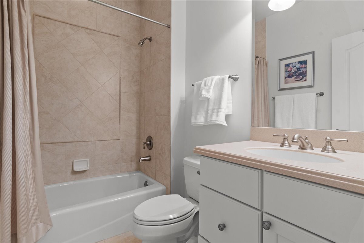 891 Carroll Road Lake Forest, IL 60045 - Photo 27 of 39 a bathroom with a granite countertop sink a toilet and shower