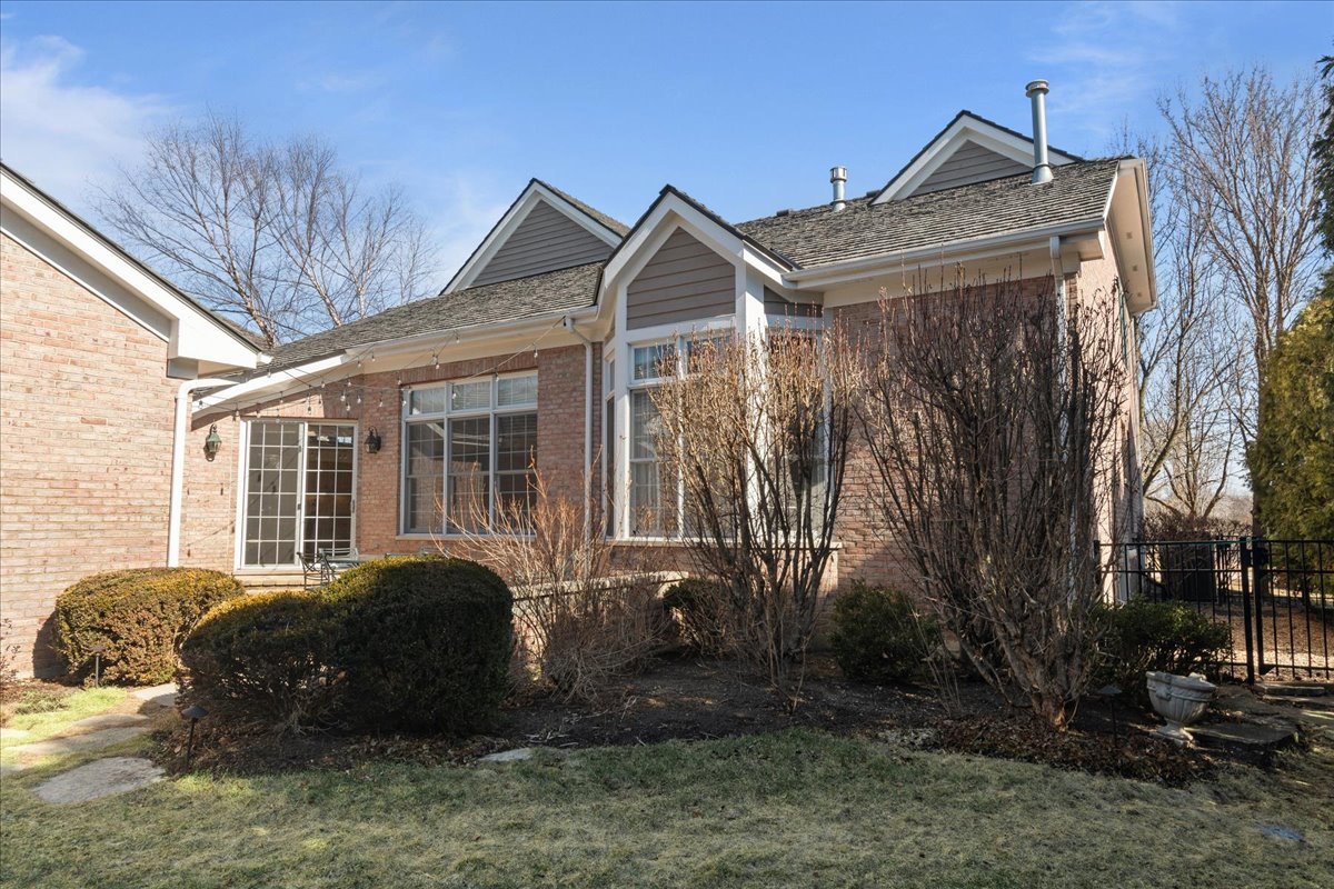 891 Carroll Road Lake Forest, IL 60045 - Photo 33 of 39 a view of a house with a large window and potted plants