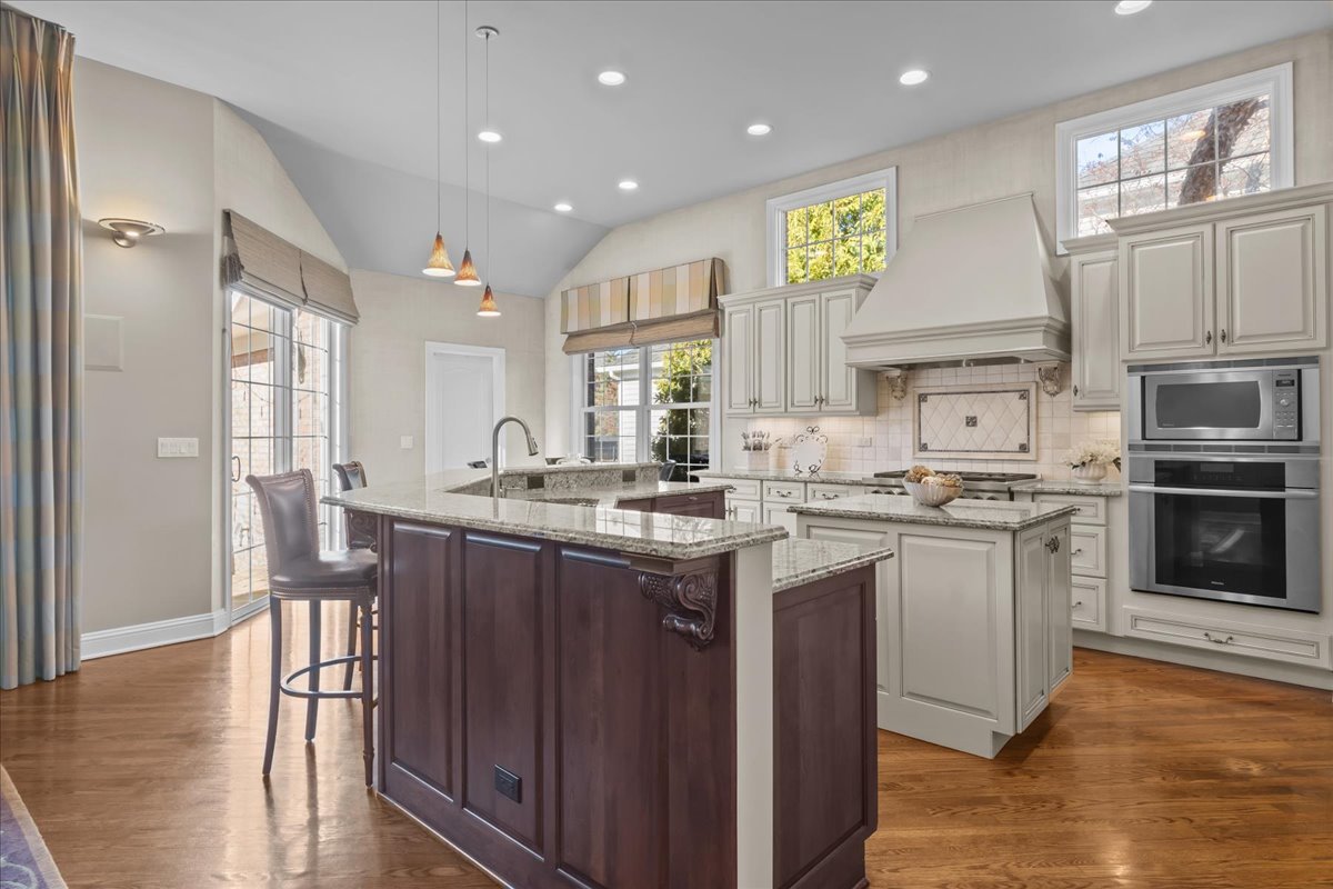 891 Carroll Road Lake Forest, IL 60045 - Photo 9 of 39 a kitchen with stainless steel appliances granite countertop a stove and a sink