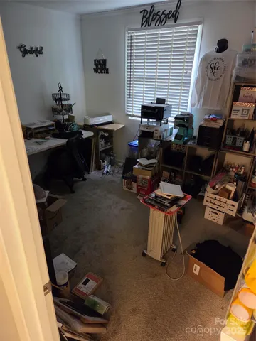 a kitchen with a refrigerator and a counter top space