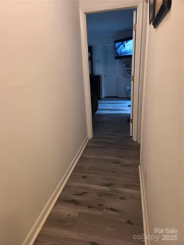 a view of a balcony with wooden floor