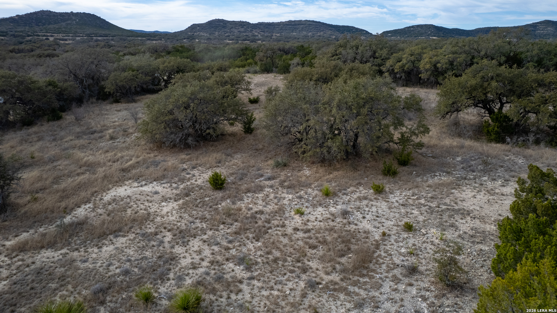 0 Little Dry Frio Road Leakey, TX 78873 - Photo 3 of 12 a view of a dry field with trees in the background