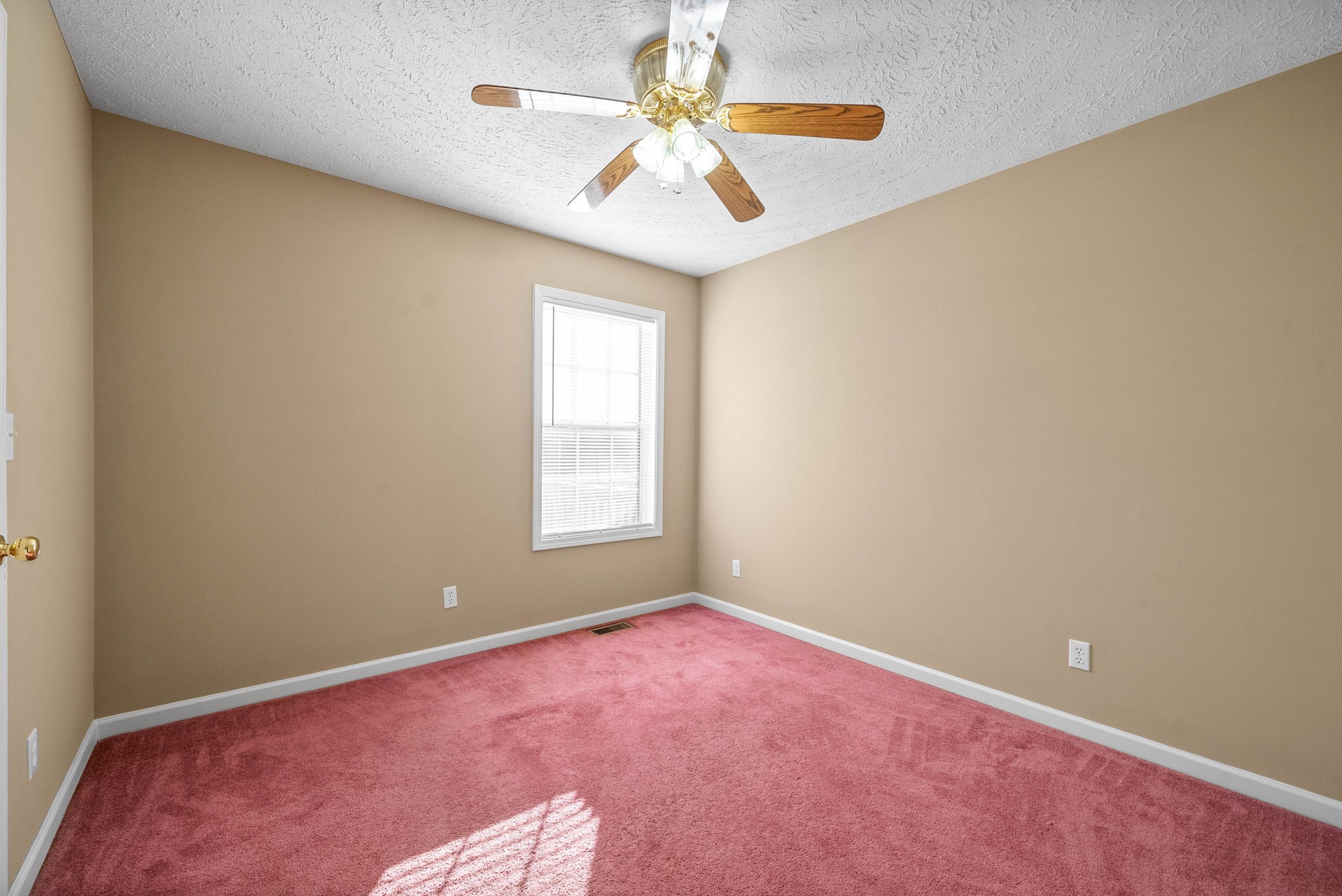 5 Adams Loop Tennessee Ridge, TN 37178 - Photo 21 of 39 an empty room with windows and chandelier fan