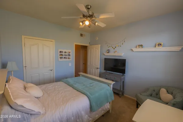 a bedroom with a bed and a fireplace