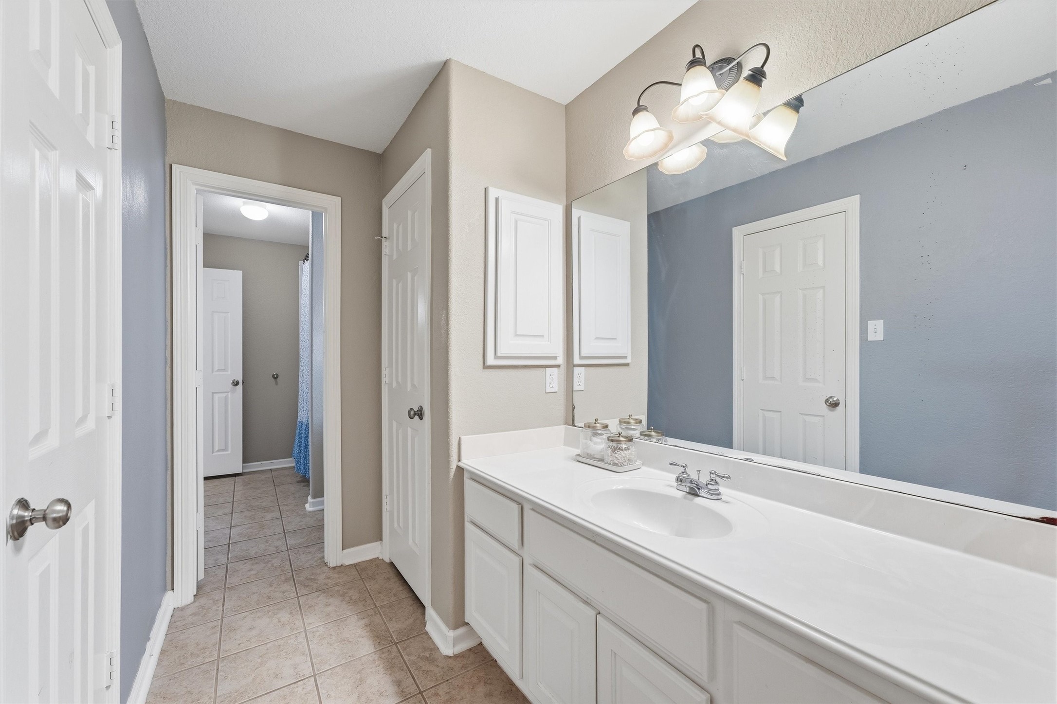 25181 Ramrock Drive Porter, TX 77365 - Photo 19 of 35 a bathroom with a double vanity sink and a mirror